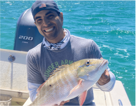 Man holding Mutton Snapper
