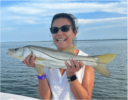 Woman posing with a Snook
