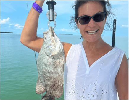 Woman holding Tripletail